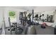 Home gym featuring exercise equipment including treadmill, weight machine, and stationary bike with rubber flooring and mirrors at 6252 Selborn Sw Dr, Atlanta, GA 30331