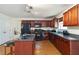 Functional kitchen with dark cabinets, stainless steel appliances, and practical layout for cooking and dining at 6252 Selborn Sw Dr, Atlanta, GA 30331