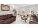 Inviting living room with plush seating, neutral carpet, and ample natural light for relaxing and entertaining at 6252 Selborn Sw Dr, Atlanta, GA 30331