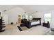 Spacious bedroom boasts vaulted ceilings, plush carpet, and a private ensuite bathroom creating a serene retreat at 6252 Selborn Sw Dr, Atlanta, GA 30331