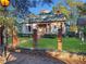 Charming two-story home with a well-manicured lawn and wrought iron fence at 668 Peeples Sw St, Atlanta, GA 30310