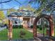 Charming single-story home with a well-maintained front lawn and an arched brick entry gate at 668 Peeples Sw St, Atlanta, GA 30310