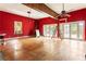 Large, bright room with hardwood floors, French doors, and ceiling fans, bathed in natural light at 668 Peeples Sw St, Atlanta, GA 30310
