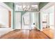 Open-concept space with decorative millwork, hardwood floors and multiple doorways for easy flow between rooms at 668 Peeples Sw St, Atlanta, GA 30310