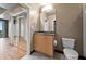 Comfortable bathroom features a granite-topped vanity, a mirror, and tile flooring at 943 Peachtree Ne St # 1010, Atlanta, GA 30309
