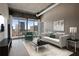 Stylish living room featuring hardwood floors, city views, and modern furniture at 943 Peachtree Ne St # 1010, Atlanta, GA 30309
