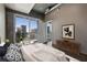 Stylish bedroom with balcony access, hardwood floors, and a modern dresser for extra storage at 943 Peachtree Ne St # 1010, Atlanta, GA 30309
