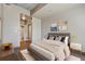 Cozy bedroom featuring hardwood floors, soft gray walls, closet with mirrored doors and ensuite bathroom at 943 Peachtree Ne St # 1010, Atlanta, GA 30309