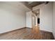 This bedroom boasts hardwood floors, neutral walls, modern baseboards, and a convenient ensuite bathroom at 943 Peachtree Ne St # 1010, Atlanta, GA 30309