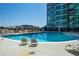 Relaxing pool with lounge chairs and umbrellas for a resort-like experience on a sunny day at 943 Peachtree Ne St # 1010, Atlanta, GA 30309