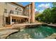Beautiful backyard with a pool, spa, and outdoor seating, perfect for relaxation at 120 Burford Holw, Alpharetta, GA 30022