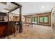Finished basement with bar, ping pong table, neutral flooring and ample lighting at 120 Burford Holw, Alpharetta, GA 30022