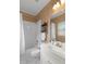 Bathroom features a shower-tub combo with a white vanity and tiled flooring at 120 Burford Holw, Alpharetta, GA 30022