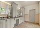 Beautiful bathroom featuring double vanities and marble floors at 120 Burford Holw, Alpharetta, GA 30022