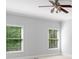 Bright bedroom with natural light coming from two windows and neutral walls at 120 Burford Holw, Alpharetta, GA 30022