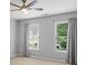 Neutral Bedroom with carpet and two windows overlooking exterior setting at 120 Burford Holw, Alpharetta, GA 30022