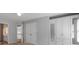 Bright bedroom with large closets, built-in wardrobe and neutral decor at 120 Burford Holw, Alpharetta, GA 30022