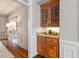 Butler's pantry boasts custom cabinets, granite countertop, and recessed lighting at 120 Burford Holw, Alpharetta, GA 30022