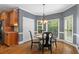 Dining room with natural light and a classic chandelier above table at 120 Burford Holw, Alpharetta, GA 30022