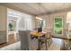 Elegant dining room features a wood table, stylish chairs, and modern light fixture at 120 Burford Holw, Alpharetta, GA 30022