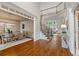 Grand foyer leading to formal dining and living areas, highlighting hardwood floors and an elegant staircase at 120 Burford Holw, Alpharetta, GA 30022