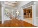Spacious foyer showcasing staircase, hardwood flooring, and custom trim details at 120 Burford Holw, Alpharetta, GA 30022