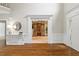 Grand foyer features hardwood floors, white trim, and high ceilings at 120 Burford Holw, Alpharetta, GA 30022