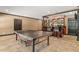 Spacious game room with a ping pong table and a bar area for entertaining at 120 Burford Holw, Alpharetta, GA 30022