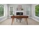 Bright home office with natural light and a view of the landscaped yard at 120 Burford Holw, Alpharetta, GA 30022
