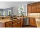 Close up of kitchen with granite countertops and stainless steel appliances at 120 Burford Holw, Alpharetta, GA 30022