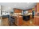 Open-concept kitchen with granite countertops, and adjacent breakfast bar at 120 Burford Holw, Alpharetta, GA 30022