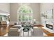Spacious living room with high ceilings, large windows, and fireplace at 120 Burford Holw, Alpharetta, GA 30022