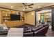 Comfortable living room featuring custom built ins, fireplace and lots of seating at 120 Burford Holw, Alpharetta, GA 30022