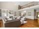 Spacious living room with hardwood floors, a fireplace and a second-story loft at 120 Burford Holw, Alpharetta, GA 30022