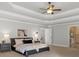 Spacious main bedroom with trey ceilings and an en suite bathroom at 120 Burford Holw, Alpharetta, GA 30022