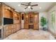 Home office with custom wood built-ins, ample storage, and natural light at 120 Burford Holw, Alpharetta, GA 30022
