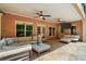 Outdoor patio features a seating area, two ceiling fans and a mounted television at 120 Burford Holw, Alpharetta, GA 30022