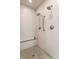 Modern walk-in shower featuring multiple shower heads and a built in bench at 120 Burford Holw, Alpharetta, GA 30022