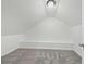 Neutral attic space featuring built in bench and carpeted floor at 2896 Toney Dr, Decatur, GA 30032
