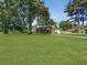 Well-manicured lawn and mature trees grace the front of this charming brick home at 2896 Toney Dr, Decatur, GA 30032