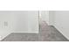 Bright hallway features neutral paint, plush gray carpeting, and white trim throughout at 2896 Toney Dr, Decatur, GA 30032