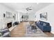 Bright living room features a fireplace, hardwood floors, ceiling fan, and an open floor plan at 2896 Toney Dr, Decatur, GA 30032
