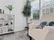 Cozy sitting area with plush chair, natural light from the window, and stylish decor at 2896 Toney Dr, Decatur, GA 30032