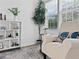 Cozy sitting area with plush chair, natural light from the window, and stylish decor at 2896 Toney Dr, Decatur, GA 30032
