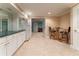 Inviting basement area featuring white cabinets, a wet bar, and a cozy seating area at 335 Cameron Ridge Dr, Atlanta, GA 30328