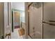 Well-lit bathroom features a shower-tub combo with a gold frame, plus a vanity in a connecting room at 335 Cameron Ridge Dr, Atlanta, GA 30328
