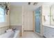 Well lit bathroom featuring a bathtub, shower and cabinets at 335 Cameron Ridge Dr, Atlanta, GA 30328