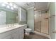 Well-maintained bathroom with a walk-in shower, a white vanity, and neutral-colored walls at 335 Cameron Ridge Dr, Atlanta, GA 30328