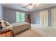 Cozy bedroom with floral wallpaper, plush carpeting, a ceiling fan, and closet at 335 Cameron Ridge Dr, Atlanta, GA 30328