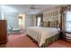 Spacious bedroom featuring a large bed, soft pink carpet and seating, with natural light at 335 Cameron Ridge Dr, Atlanta, GA 30328